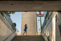 Edgar-Quinet-station;-Kaleidos;-Kaleidos-images;-La-parole-à-limage;-Metro-exit;-Metro-staircase;-Montparnasse-district;-Motion;-Paris;-Red-sign;-Stories-Pictures;-Summer;-Tarek-Charara;-Tour-Montparnasse;-Walking-away;-White-tiles;-Young-woman